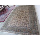 A hand knotted woollen Kashan rug - 320cm x 210cm