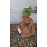 A terracotta roof ridge tile surmounted by a winged dragon - 44cm H x 46cm L x 26cm W