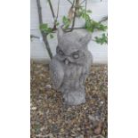 A life size garden figure of a long eared owl in cast stone - 51cm H