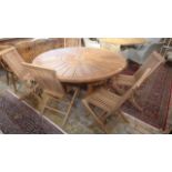 A Bramblecrest 150cm round teak table with inbuilt Lazy Susan with six Cotswold teak folding side