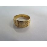 An 18ct gold ring, approx 5.7 grams, ring size Q, usage marks consistent with age and wear