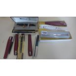 A collection of Parker Biros and pencil, also pair of Zola pens