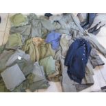 A large quantity of assorted military and military style clothing and two pairs of boots