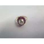 An 18ct yellow gold pearl and ruby ring, size K, approx 4 grams, in good condition, minor