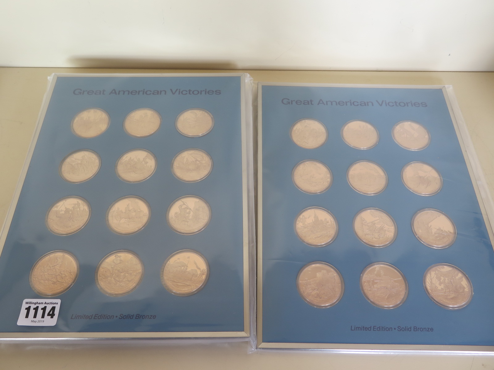 A collection of twenty-four Great American Victories bronze tokens
