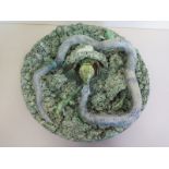 A Portuguese Palissy ware wall plate with reptiles, bearing an impressed mark, Jose a Cunha,