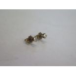 A pair of 18ct gold diamond solitaire earrings, approx 0.3ct diamonds, with receipt for 882 Swiss
