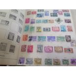 A collection of World stamps in large Abria album with a good selection of Brazil material included