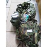 A rucksack of military clothing and equipment, rucksack dated 1990, with accessories