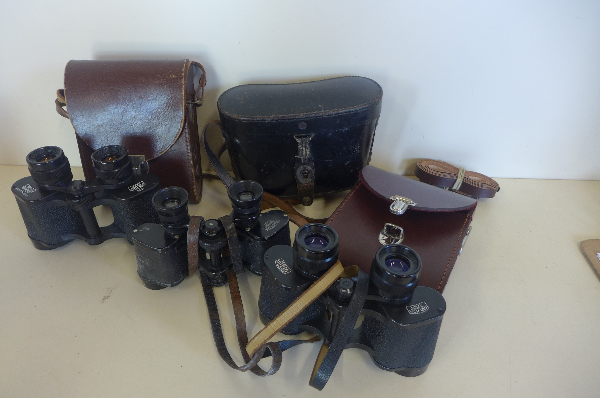 Two pairs of Carl Zeiss Jena 8x30W binoculars, and a pair of Volgtlander binoculars 6x24