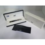 A Mont Blanc - Ruby - rollerball pen with box and instructions, in good condition, needs a refill