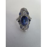 A platinum diamond and Art Deco ring, the central stone approx 11x7mm, head size 25x13mm, total