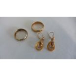 A pair of gilt metal earrings, a gilt metal two piece ring, size U, approx 5.9 grams and a brass