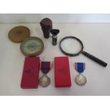 A George VI and a Queen Elizabeth II Coronation medals with original boxes together with other