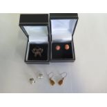 A pair of 9ct gold and amber drop earrings, pair of silver gilt and coral studs and pair of silver