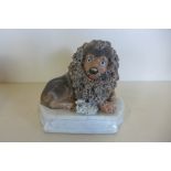 A Staffordshire figure of lion and lamb - 10cm tall overall, obvious repairs, please see images