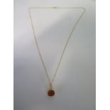 An 18ct yellow gold topaz pendant on an 18ct yellow gold 45cm chain, stone approx 9x7mm, in good