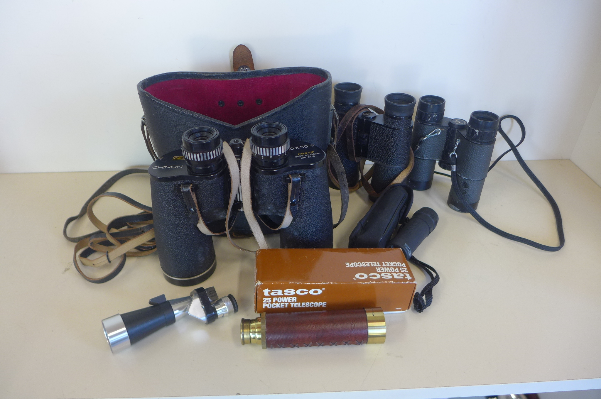 A pair of Chinon 10x50 binoculars, a pair of Zeiss and Trilyte binoculars and three pocket