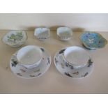 Two Russian porcelain tea cups and saucers by Gardner of Moscow, together with four small pieces