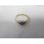 A 9ct gold emerald and diamond ring, size M, approx 2.1 grams, in good condition overall, but with