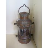 A brass and copper anchor ships lantern, 34cm tall