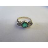 A 9ct yellow gold green and white stone three stone ring, size Q/R, approx 3.8 grams