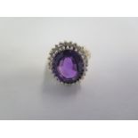A 9ct yellow gold diamond and amethyst ring, size K, approx 4 grams, in good condition, minor
