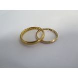 A 22ct wedding band, ring size T, approx 6.4 grams, and a 9ct band ring, size R, approx 1.8 grams