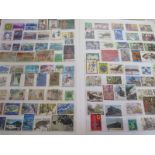 A collection of mid-period Japan stamps â€“ both mint and used â€“ in a large stock-book