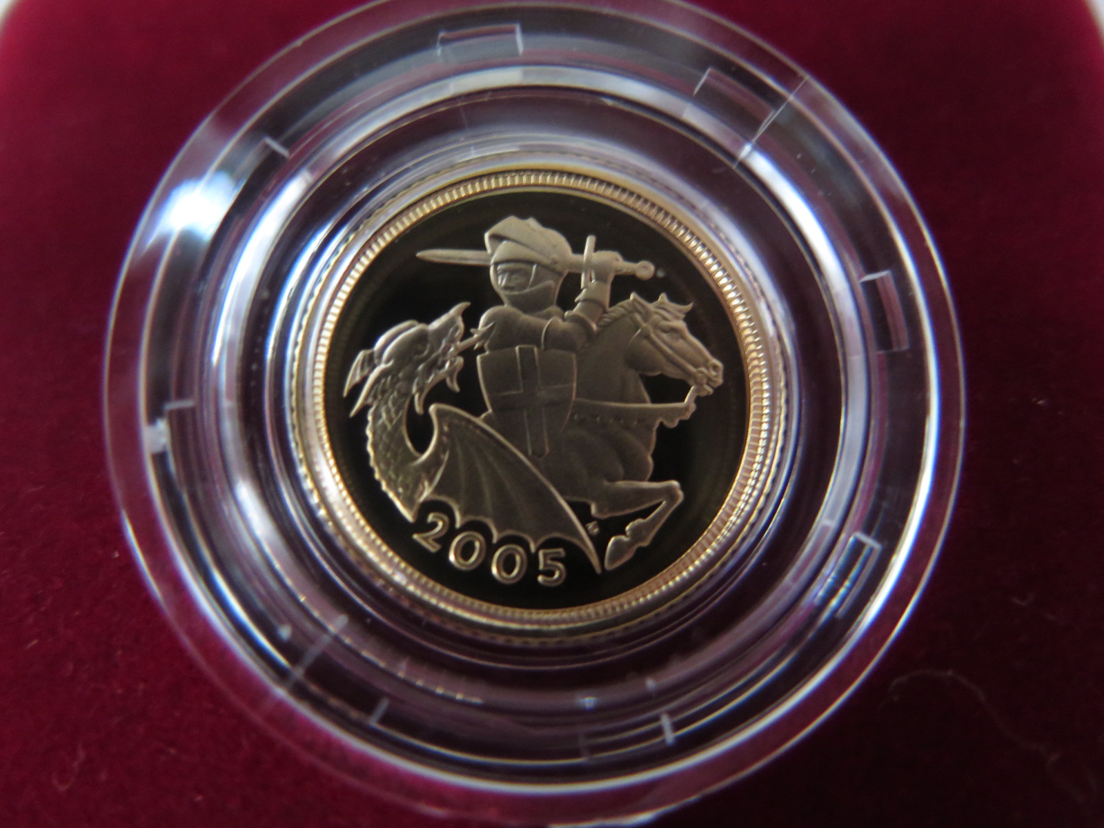 A 2005 gold proof half sovereign, approx 3.9 grams, with certificate and presentation case, in