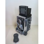 A Mamiya C33 professional twin lens Reflex camera with Mamiya-sekor 1.2.8 f 9mm lens, no 813732