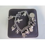 A silver charm bracelet, approx 27.4 grams, hallmarked 925 sterling, some usage wear, generally