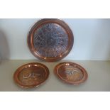 Three Islamic copper plates with white metal inlay, 29cm x 19cm diameter