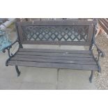 A wooden slatted garden bench with metal ends and back, 135cm wide