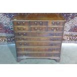 A mahogany chest with six small drawers above five long drawers on bracket feet, 87cm tall x 86cm