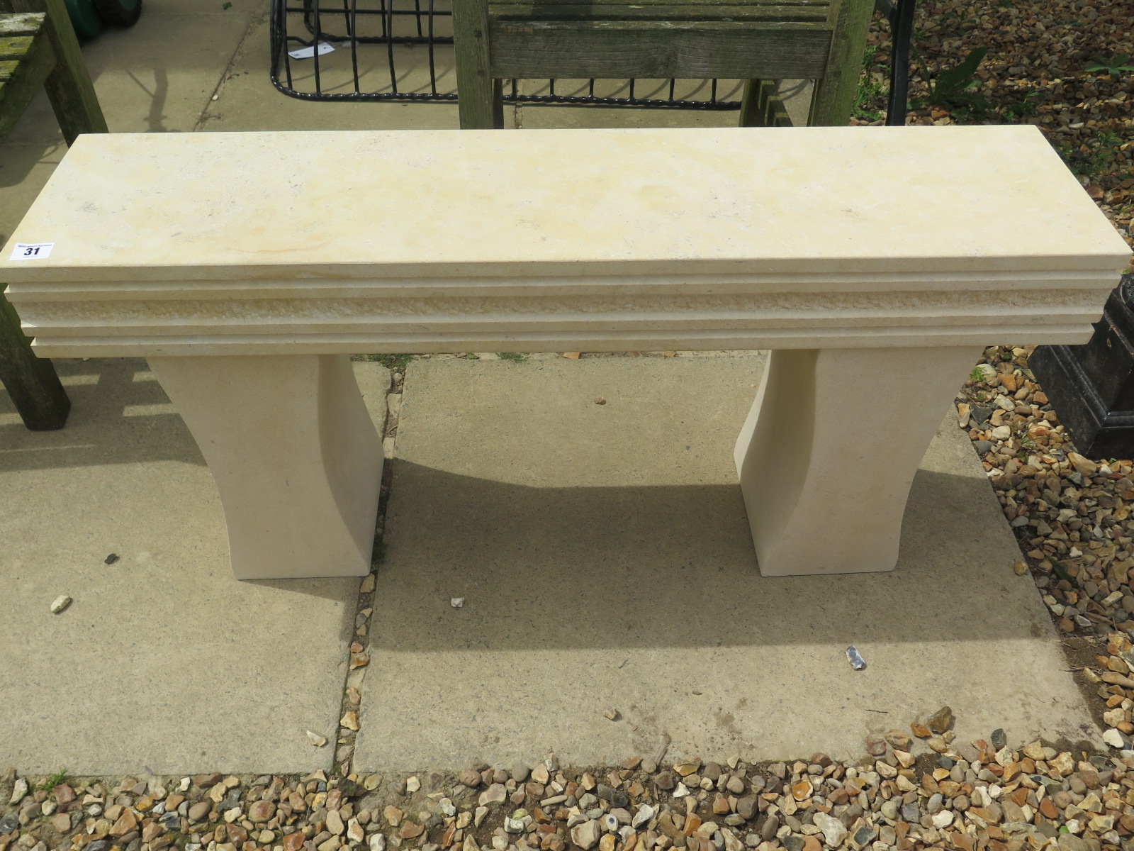 A natural limestone garden bench, 93cm wide