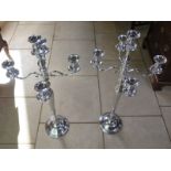 A pair of white metal four branch candelabra, approx 101cm high, in good condition
