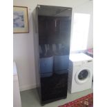 A John Lewis fridge freezer, KE26E580 in working order, some marks to sides, 190cm tall x 59cm wide,