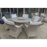 A Bramblecrest sample six seater flat weave 140cm dining set with Lazy Susan, ex-display