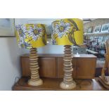 A pair of wooden pebble lamps and shades, in working order - 94cm tall