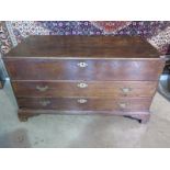 An 18th century oak mule chest with rising top, over two drawers on bracket feet, 125cm wide x