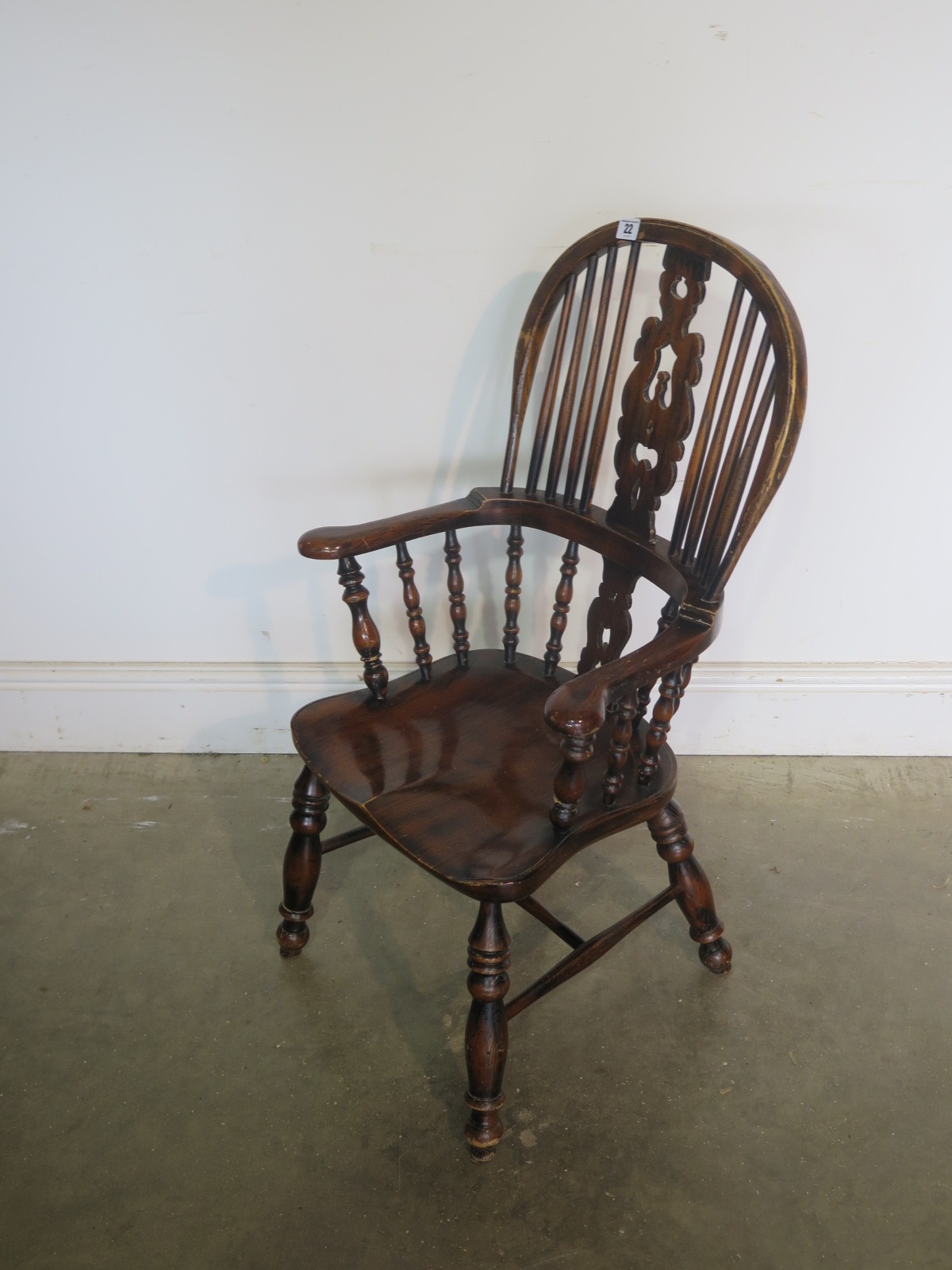 A childs Victorian style high back Windsor armchair - 84cm Tall