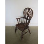 A childs Victorian style high back Windsor armchair - 84cm Tall