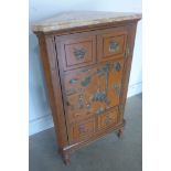 A George III mahogany and soapstone hanging corner cabinet with a late marble top and turned legs,