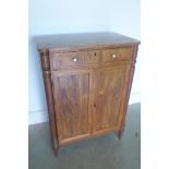 A George III rosewood side cabinet, circa 1800, the rectangular top above a frieze drawer, below a