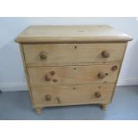 A 19th century pine chest with three drawers, 87cm wide x 85cm high