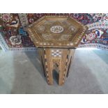 An inlaid octagonal Islamic Damascus type side table, 49cm x 29cm - some inlay losses