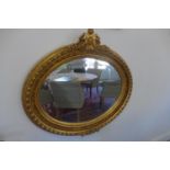An ornate mirror, 94cm H x 100cm W