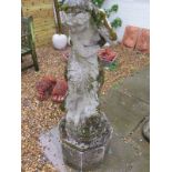 A stone garden statue of a lady with a plinth - 116cm