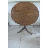 A 19th century oak tripod with tilting circular top, approx 81cm diameter, in good condition with